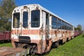 Old ruined steel passenger car. Rusty train on railway tracks Royalty Free Stock Photo