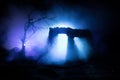 Old ruined stone house in deserted garden at night. Selective focus Royalty Free Stock Photo