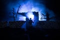 Old ruined stone house in deserted garden at night. Selective focus Royalty Free Stock Photo