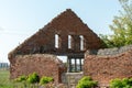 Old ruined stone house in the village. Red brick house built in the last century. Historical value. Demolition of buildings Royalty Free Stock Photo