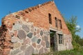 Old ruined stone house in the village. Red brick house built in the last century. Historical value. Demolition of buildings Royalty Free Stock Photo