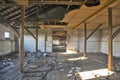 Old ruined warehouse that was almost demolished. The sky can be seen through the roof. Royalty Free Stock Photo