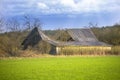 Old ruins of barn with broken roof Royalty Free Stock Photo