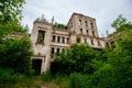 Old ruins of historical mansion Lopandino, Bryansk oblast, overgrown by vegetation green post-apocalyptic concept