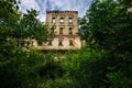 Old ruins of historical mansion Lopandino, Bryansk oblast, overgrown by vegetation green post-apocalyptic concept