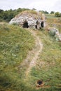 Old ruins of Skala Podilskyi castle, Ukraine. Destroyed ruined stone walls of medieval castle and green grass, historical defence Royalty Free Stock Photo