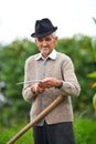 Old rural man using scythe Royalty Free Stock Photo