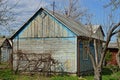 Old rural wooden house in the courtyard of a blue gray Royalty Free Stock Photo