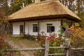 Old rural wooden house with thatched roof. Fall season. Close-up Royalty Free Stock Photo