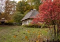 Old rural wooden house with thatched roof. Fall season. Close-up Royalty Free Stock Photo
