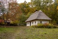 Old rural wooden house with thatched roof. Fall season. Close-up Royalty Free Stock Photo