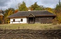 Old rural wooden house with thatched roof. Fall season. Close-up Royalty Free Stock Photo