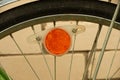 Old Russian bicycle orange reflector on the tire