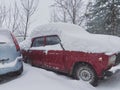 Old Russian Car Under the Snowdrift Royalty Free Stock Photo