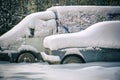 Old russian cars buried under a thick layer of snow Royalty Free Stock Photo