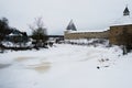 Old Russian fortress in Staraya Ladoga, Russia and the ice-covered river. Royalty Free Stock Photo