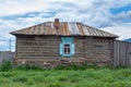 Old Russian log house with window and carved shutters. Royalty Free Stock Photo