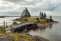 Old russian Orthodox wooden church in the village Rabocheostrovsk, Karelia. Abandoned church on the coastline.