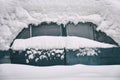 Old russian soviet car buried under the snow Royalty Free Stock Photo