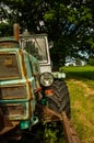 Old Russian tractor with a lamp and tire Royalty Free Stock Photo