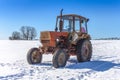 Old Russian tractor in snow Royalty Free Stock Photo