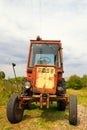 Old Russian tractor in the yard of a farm Royalty Free Stock Photo
