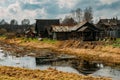 Old russian village in the marshland. Wooden houses