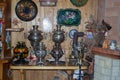 Old Russian village samovars and trays in the interior of a wooden house Royalty Free Stock Photo