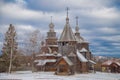 The old Russian wooden Church consisted of several tiers with a cross at the top. Museum of wooden architecture Royalty Free Stock Photo