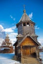 The old Russian wooden Church consisted of several tiers with a cross at the top. Museum of wooden architecture Royalty Free Stock Photo