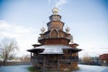 The old Russian wooden Church consisted of several tiers with a cross at the top. Museum of wooden architecture Royalty Free Stock Photo