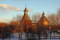 Old Russian wooden church and tower at winter day Royalty Free Stock Photo