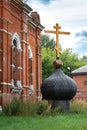 Old russsian chirch tip with golden cross separate bring down on ground and grass old deserted chirch Royalty Free Stock Photo