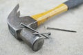 Old rust hammer and nails on wood board Royalty Free Stock Photo