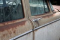 old rusted American car with door handle Royalty Free Stock Photo