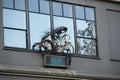 Old rusted bicycle decorating the window Royalty Free Stock Photo