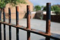 Old rusted black metal railing fence