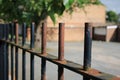 Old rusted black metal railing fence