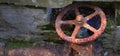 Old Rusted and Broken Water Pipe with Turn Wheel Valve Royalty Free Stock Photo