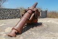 Old rusted cannon from World War II. Japanese cannon Meriam Jepang in a stone fortification on the island of Lombok in