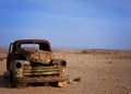 Old rusted car desserted in the desert