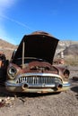 Old rusted car in junk yard Royalty Free Stock Photo