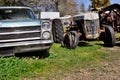 Old rusted car and tractor Royalty Free Stock Photo