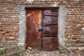 Old rusted door and brick wall