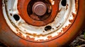 an old rusted fire hydrant with holes in the middle of it\'s rim and a button on the top of the tire Royalty Free Stock Photo