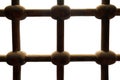 Old rusted grunge ornate intersected iron bars window isolated on white, with clipping path