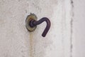 Old rusted hooks on white walls. Royalty Free Stock Photo