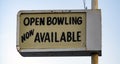 Old Rusted Lighted Sign at Recreation Center says Open Bowling Royalty Free Stock Photo