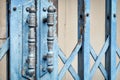 Old rusted lock on blue rusty iron gate Royalty Free Stock Photo