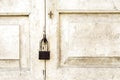 Old rusted lock on old white door Royalty Free Stock Photo